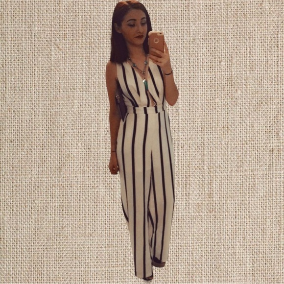 Pants - Black and white striped jumpsuit with a deep plunge